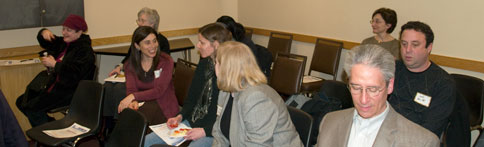 Boston-IA members chat before a meeting.