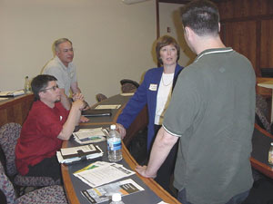 Boston-IA founder P.J. Gardner talks with information architects Peter Picone, Jim Ospenson, and Anthony Hand.